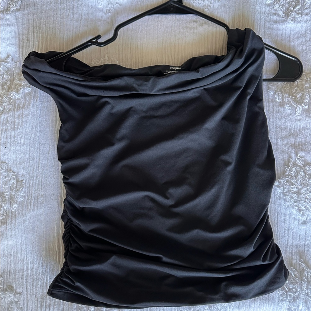 Black going out top